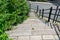 Beautiful stone and concrete steps leading down onto the pavement sidewalk.