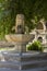 Beautiful stone fountain in the Governor`s garden of Baku, Azerbaijan. Fountain close-up in the shade of trees on a hot summer day