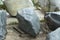 Beautiful stone in the park. A large piece of rock on the street. The cobblestones are prepared for installation in the garden