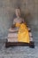 Beautiful stone statue of buddha with yellow scarf in ancient angkor wat temple, religous site for hindu and buddhism
