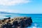 Beautiful stones on the ocean. Against the blue sky. Relaxation. Vacation Travels. Seascape