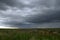 Beautiful storm sky with clouds and field