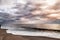 Beautiful stormy sky over Atlantic ocean. Colorful dramatic seascape with dark clouds.