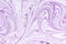 Beautiful streaks of lilac paint. Empty background for layouts. The process of mixing purple and white paint.