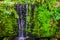 Beautiful streaming waterfall, tropical garden architecture, nature background