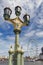 Beautiful street lamp on Westminster Bridge in London with London Eye, popular landmark of the city seen in background