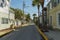 Beautiful street landscape view of one of streets in Key wet, Florida. Light houses and green palm trees on blue sky background