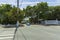 Beautiful street landscape view of one of streets in Key wet, Florida. Light houses and green palm trees on blue sky background.