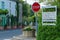 Beautiful street with signs for tourists with flowers of Burgundy region in Cormatin