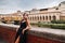 A beautiful stylish bride in a black dress walks through Florence, a Model in a black dress in the old city of Italy