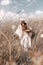 Beautiful stylish young countryside woman on the field