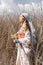 Beautiful stylish young countryside woman on the field