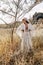 Beautiful stylish young countryside woman on the field