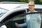 Beautiful successful smiling rich business woman in white suit standing near gray car salon , wearing glasses holds the keys on