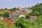 Beautiful summer cityscape with building roofs between heels and