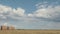 Beautiful Summer Farm Scenery with Haystacks. Field Landscape with Rolls and Sky. Agriculture Concept.