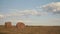 Beautiful Summer Farm Scenery with Haystacks. Field Landscape with Rolls and Sky. Agriculture Concept.