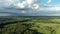 Beautiful summer landscapes with forest, sun and river. Clouds and rain on the horizon.