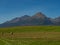 Beautiful summer panorama over Spisz highland with sheaves of hay to Tatra mountains, Poland