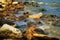 Beautiful summer seascape, seashore on a bright day, stones and splashes of waves