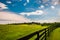 Beautiful summer sky over fence and estate in Southern York County, Pennsylvania.