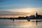 Beautiful Summer sunset landscape over low tide harbor with moor