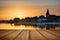 Beautiful Summer sunset landscape over low tide harbor with moor