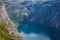 Beautiful summer vibrant view on famous Norwegian tourist place - trolltunga, the trolls tongue with a lake and mountains, Norway,