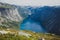 Beautiful summer vibrant view on famous Norwegian tourist place - trolltunga, the trolls tongue with a lake and mountains, Norway,