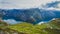 Beautiful summer vibrant view on famous Norwegian tourist place - trolltunga, the trolls tongue with a lake and mountains, Norway,