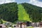 Beautiful summer view of the slope and hotels in resort Bukovel.