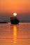 Beautiful Sun and silhouette of Dhow at dawn
