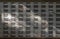 Beautiful sunlight shine on rows of white wooden mailboxes with keyholes for resident in condominium