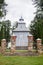 Beautiful sunlit gray wooden Catholic church