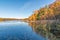 Beautiful sunny autumn day on small remote lake in Northern Wisconsin - fall colors and reflection of trees on calm lake waters