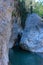 Beautiful Sunny lagoon in rocks and greenery with clear water