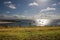 A beautiful sunny summer morning overlooking Weymouth bay with sun reflecting on the sea