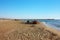 Beautiful sunny winter day on the sandy beach of Versilia at Forte dei Marmi. The wharf on the horizon, a little blue sea and a