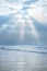 Beautiful sunrays in sky over ocean