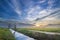 Beautiful sunrise at canal with colorful sky and clouds