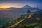 Beautiful sunrise of Dieng with longexposure light painting on the roads.