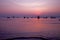 Beautiful sunrise. Fishing boat silhouette with orange sunrise sky and water reflection