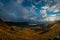 Beautiful sunrise on the Jaufenpass or Passo Giovo in northern italy with beautiful road winding on the mountain and sun just