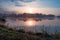 Beautiful sunrise at lake surrounded by forest in KrasnobrÃ³d, Roztocze, Poland