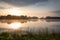 Beautiful sunrise at lake surrounded by forest in KrasnobrÃ³d, Roztocze, Poland