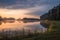 Beautiful sunrise at lake surrounded by forest in KrasnobrÃ³d, Roztocze, Poland