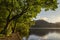 Beautiful sunrise landscape image looking across Loweswater in the Lake District towards Low Fell and Grasmere with vibrant