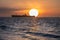 Beautiful sunrise landscape over black sea. Sun rise over ship wreck
