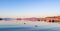 Beautiful sunrise on Mediterranean coast with islands and mountains, boats and catamarans