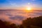 Beautiful sunrise in the morning over foggy tropical forest, Long exposure photography.